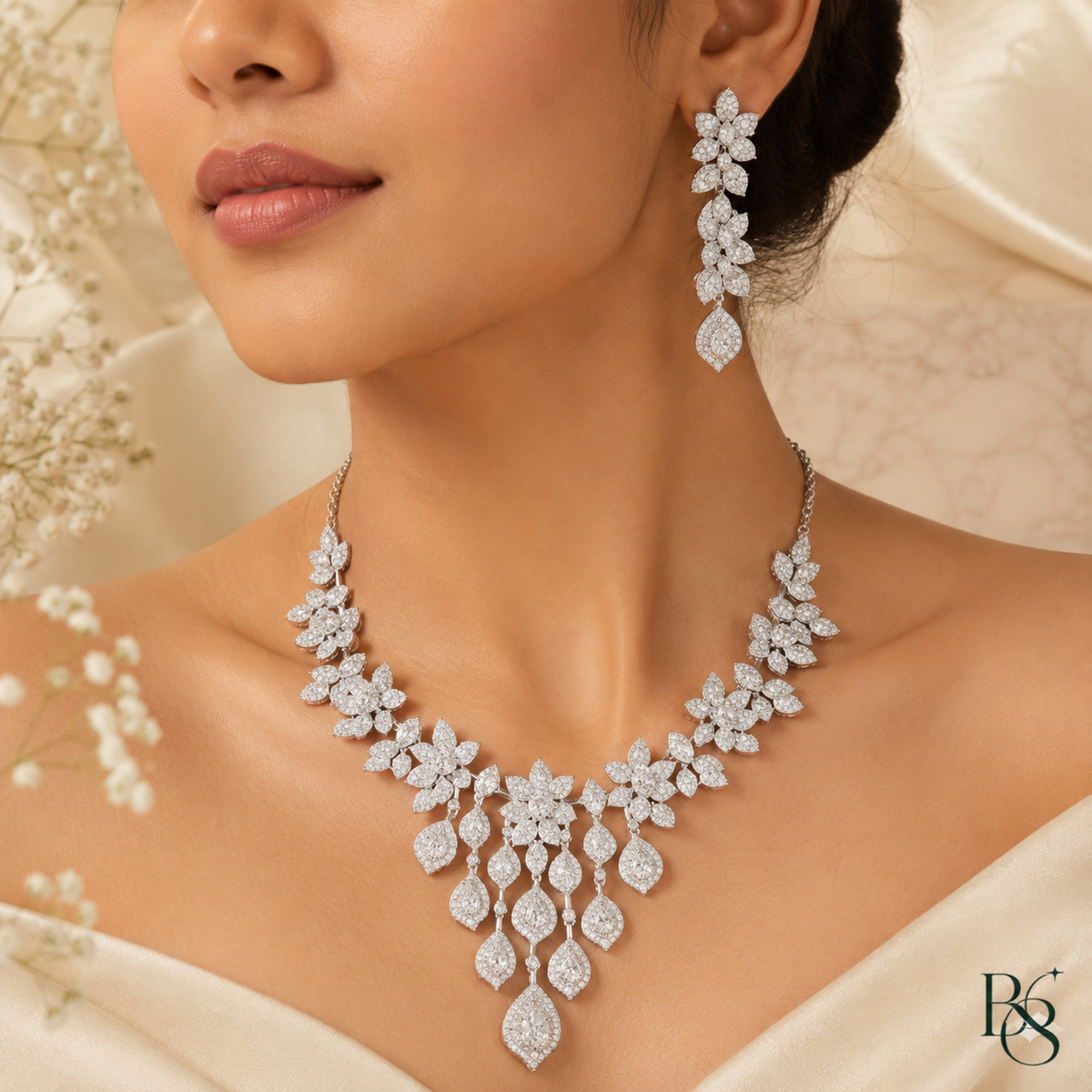 Model wearing silver floral chandelier necklace set by Bright & Beryl