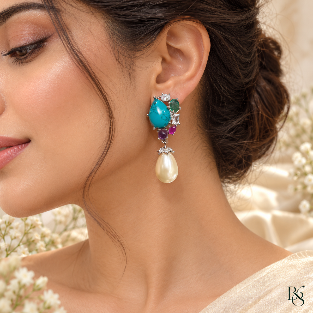 Model wearing turquoise pearl statement earrings by Bright & Beryl