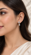 Reversed model wearing Crystal Teardrop Solitaire Earrings