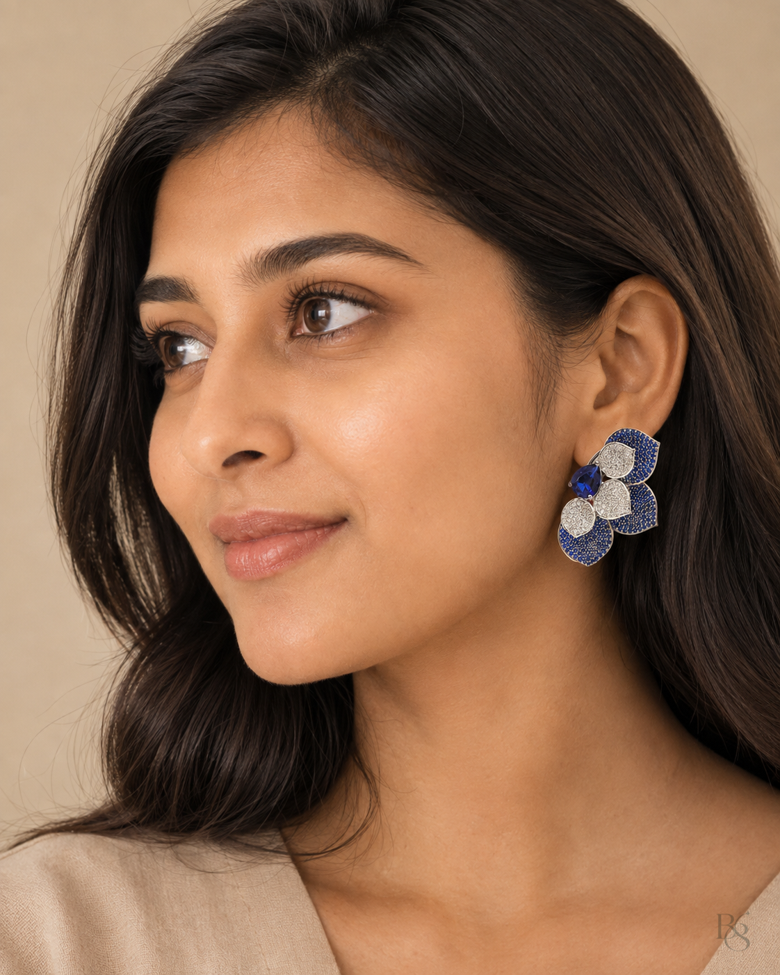 Model wearing Luxe Petal Cluster Statement Earrings in Sapphire Blue
