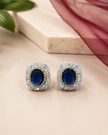 Regal Oval Halo Stud Earrings in Sapphire Blue