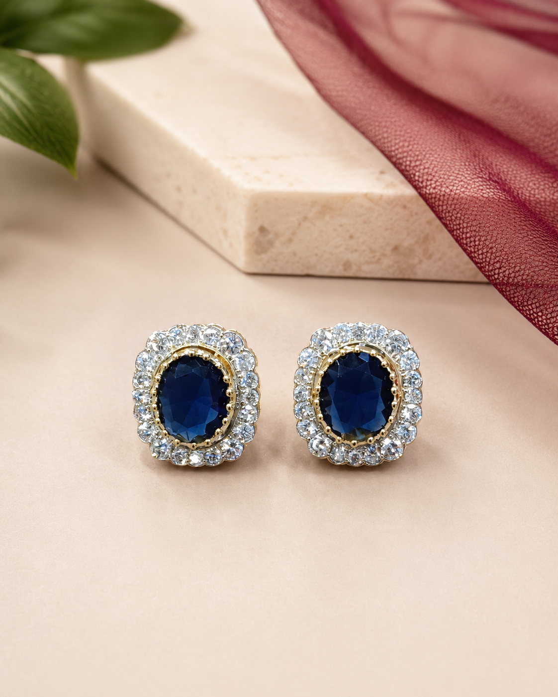 Regal Oval Halo Stud Earrings in Sapphire Blue