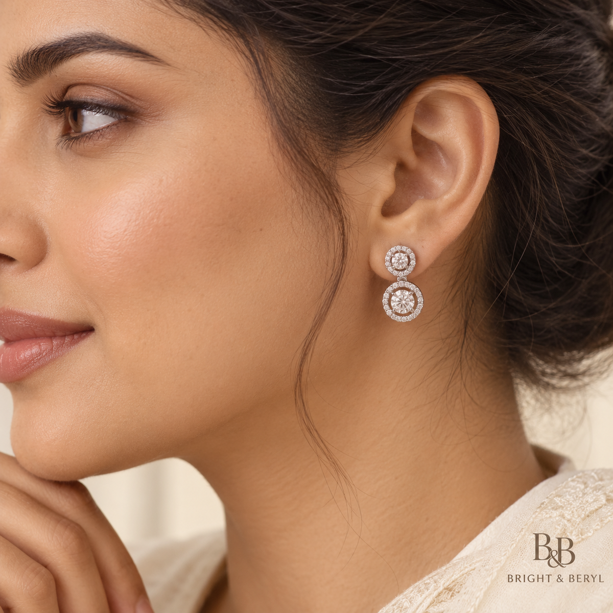 Round Double Halo Drop Earrings worn by a model