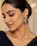 Model wearing Sapphire Fan Statement Earrings